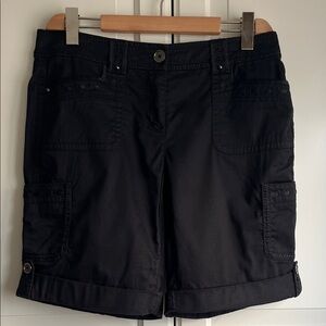 White House Black Market cuffed shorts in black. Satin trim. Size US 4
